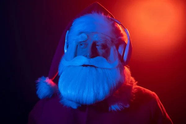 Santa Claus Listens Music Headphones Party Blue Red Neon Light — Stock Photo, Image