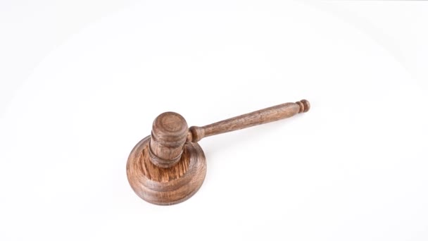 Wooden Judges Gavel Spinning White Background Top View — Stock Video