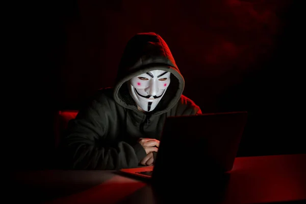 June 2022 Novosibirsk Russia Anonymous Hood Typing Laptop Dark Red — Stock Photo, Image