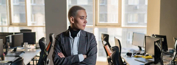 Business woman with short haircut in empty office