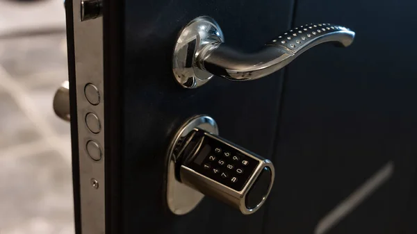 Open door to the apartment with a combination lock. Keyless entry