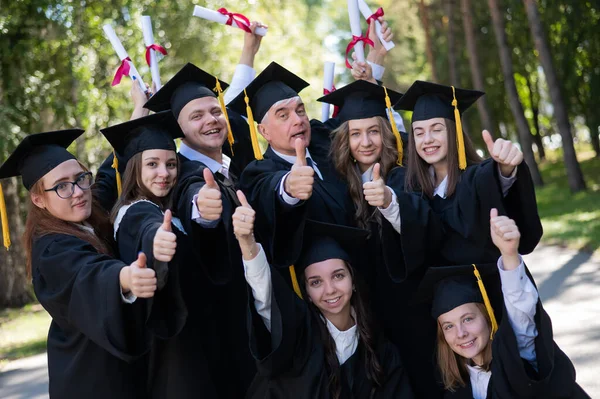 Group Graduates Robes Give Thumbs Outdoors Elderly Student — Stock Photo, Image