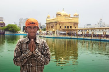Young pilgrim in Golden temple clipart