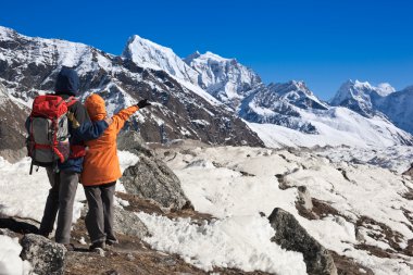 Trekkers in Himalayas clipart