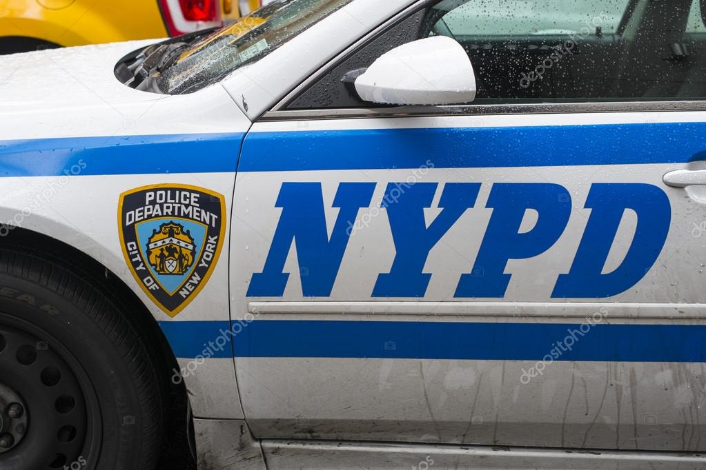 NEW YORK, US - NOVEMBER 22: Detail of door of New York Police car showing crest and NYPD letters. November 22, 2013 in New York.