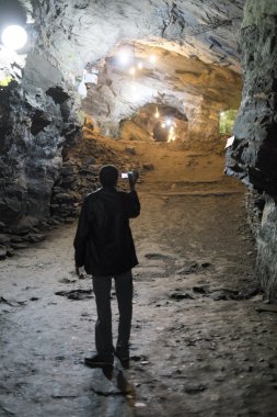 OURO PRETO, BRAZIL - JULY 27: Tourist filming the Passage Mines  clipart
