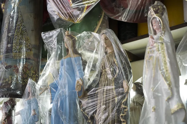 BELO HORIZONTE, BRAZIL - JULY 28: Religious icons wrapped in pla — Stock Photo, Image