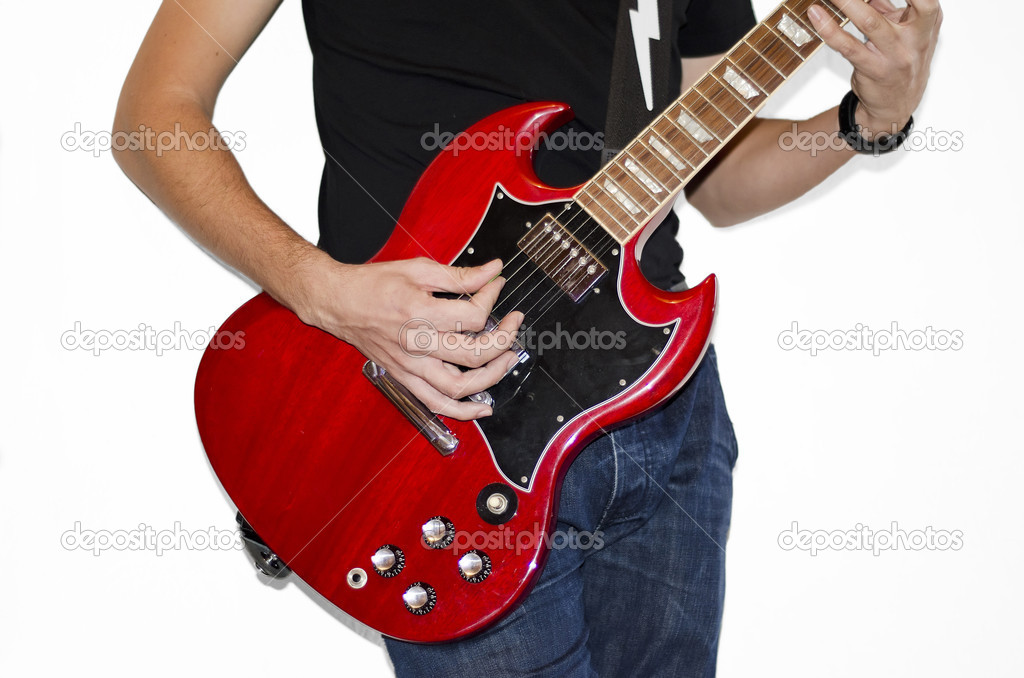 Guitarist playing on electric guitar
