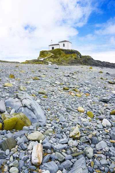 Beautiful church in a rocky beach — Stock Photo, Image