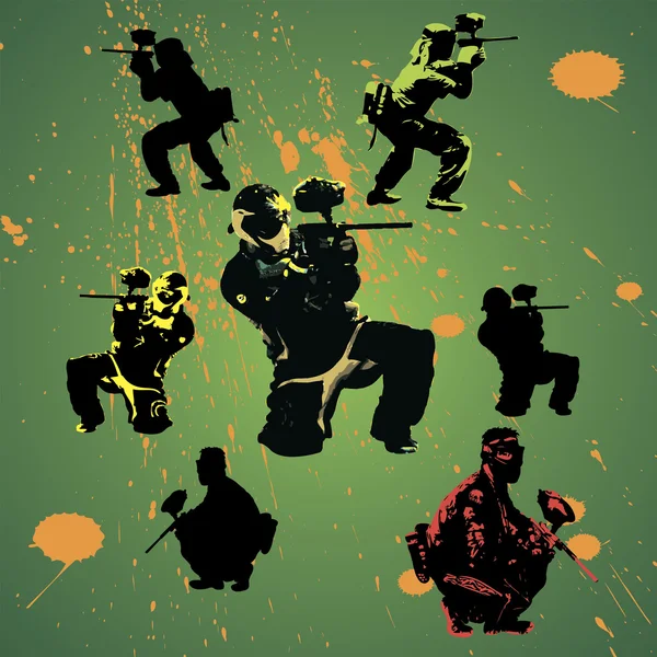 Paintball players silhouettes with grunge drops — Stock Vector
