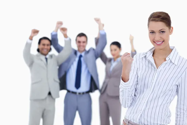 Secretary smiling and clenching her fist with enthusiastic busin — Stock Photo, Image