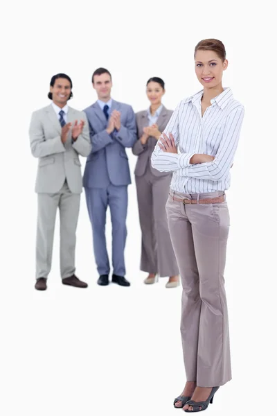 Woman crossing her arms with business applauding while wa — Stock Photo, Image