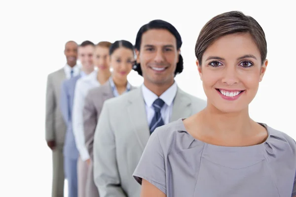 Big close-up of colleagues in a single line smiling and looking — Stock Photo, Image