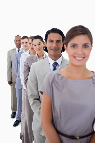 Close-up of co-workers in a single line looking straight — Stock Photo, Image
