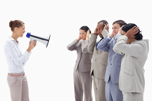 Woman yelling happily at business covering their ears wit — Stock Photo, Image