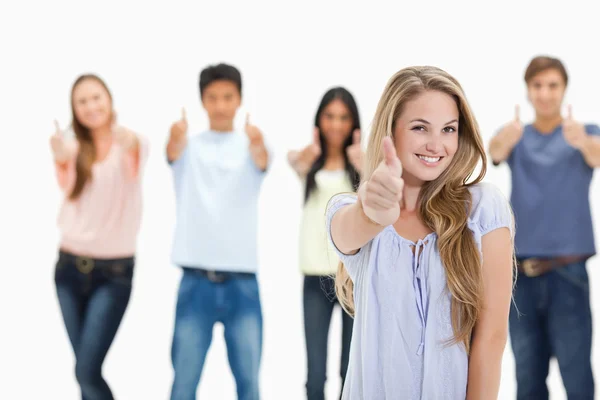 Close-up of smiling and approving with one woman in foreg — Stock Photo, Image