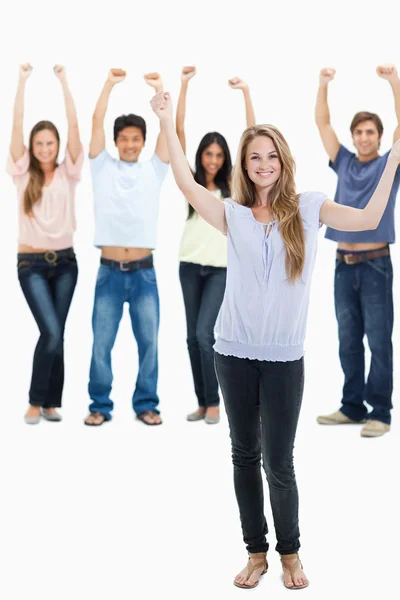 In jeans with their arms raised — Stock Photo, Image