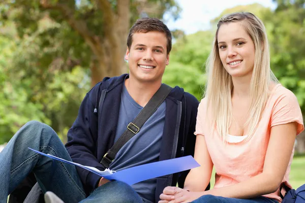 Portrait of a tutor helping a teenager to revise — Stock Photo, Image