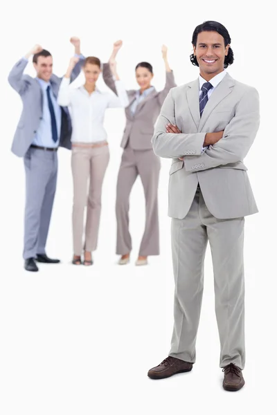 Businessman smiling and crossing his arms with cheering b — Stock Photo, Image
