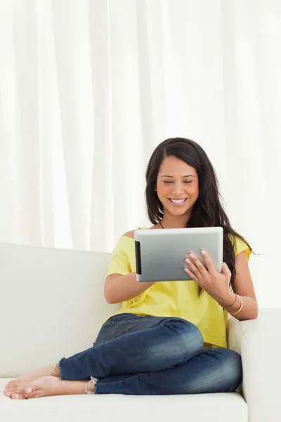 Happy Latino using a touch pad — Stock Photo, Image