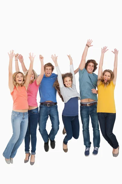 Celebrating friends jumping in the air — Stock Photo, Image