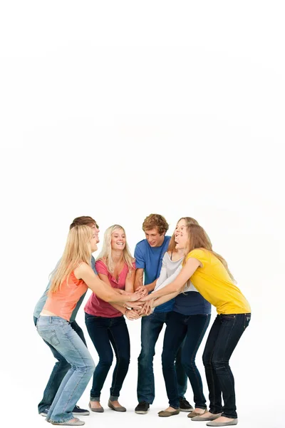 Grupo de amigos a punto de animar con las manos apiladas —  Fotos de Stock