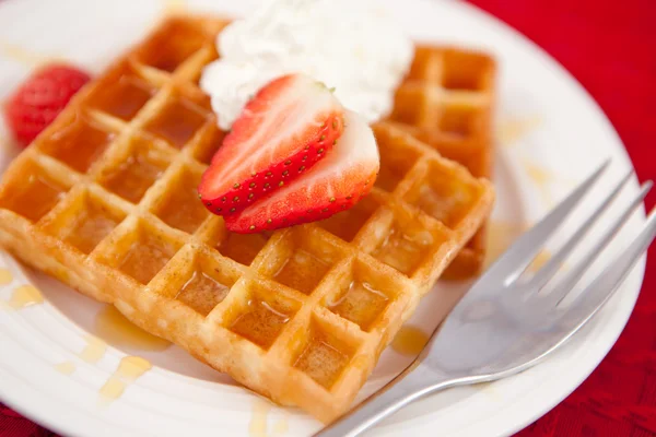 Waffles with whipped cream and strawberry on it — Stock Photo, Image