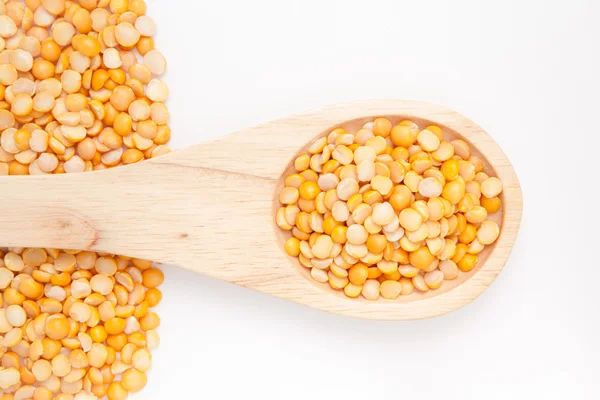 Wooden spoon with lentils — Stock Photo, Image