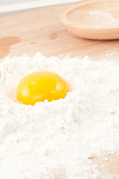 Egg yolk on the flour — Stock Photo, Image