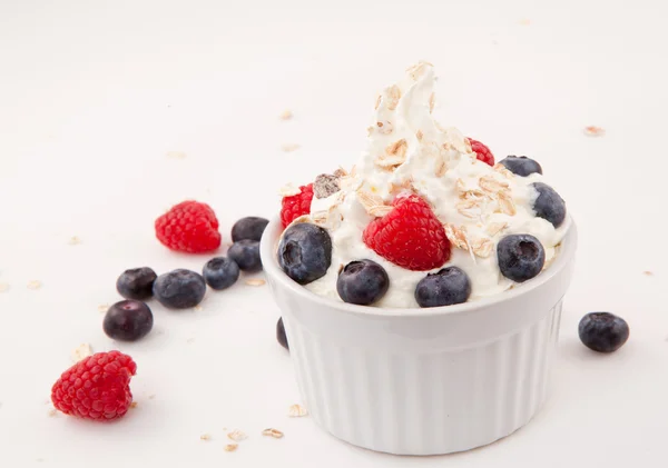 White jar of berries and whipped cream — Stock Photo, Image