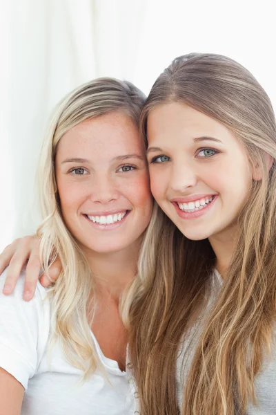 Close up of a smiling pair of sisters Stock Photo