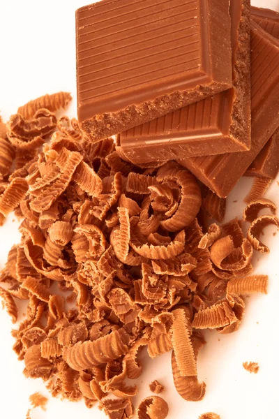 Close up of pile of chocolate pieces and chocolate shavings — Stock Photo, Image