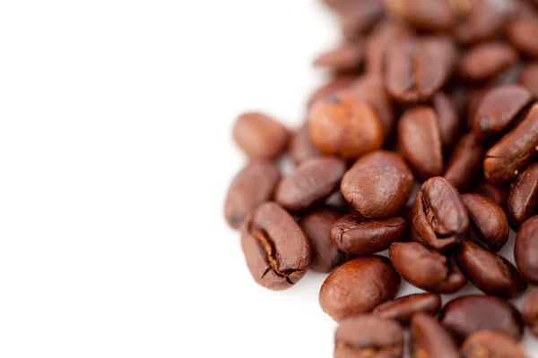 Dark blurred coffee seeds laid out together — Stock Photo, Image