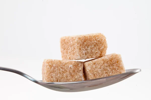 Spoon with brown sugar — Stock Photo, Image