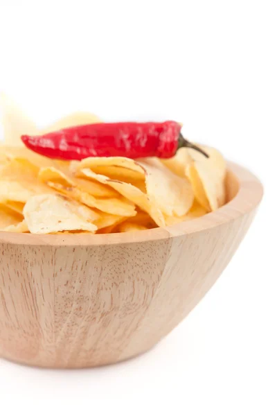 Pimento on a wooden bowl of chips — Stock Photo, Image