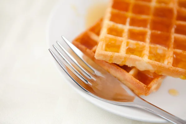 Two waffles and a fork on a saucer — Stock Photo, Image