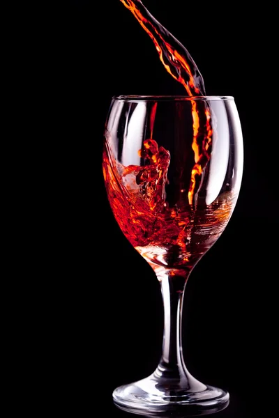 Empty glass being filled with wine — Stock Photo, Image