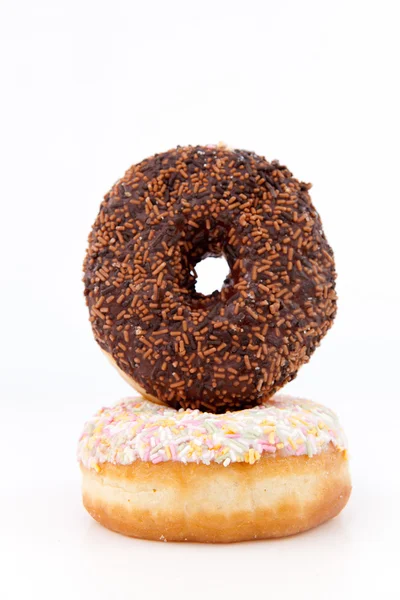Donuts com açúcar de confeiteiro multicolorido — Fotografia de Stock
