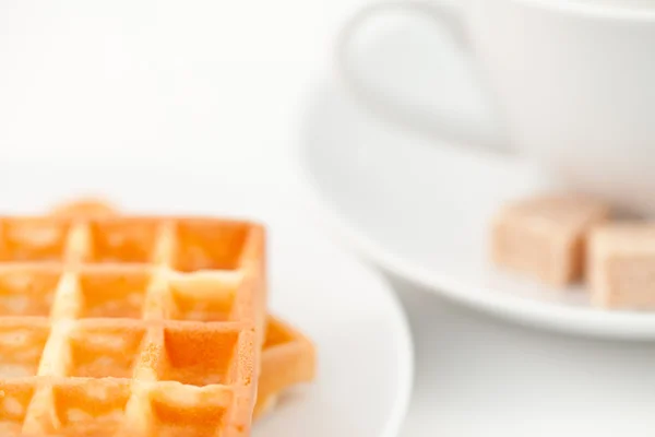 Waffles sugar and coffee on white plate — Stock Photo, Image