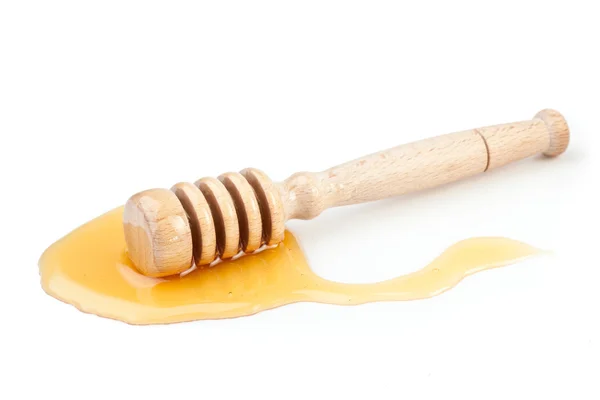 Μέλι κουτάλα στο πάτωμα χυθεί μέλι — Φωτογραφία Αρχείου