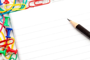 Notepad with large group of muti coloured stationery and a penci clipart
