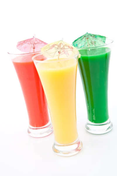 Three glasses with cocktail umbrella — Stock Photo, Image