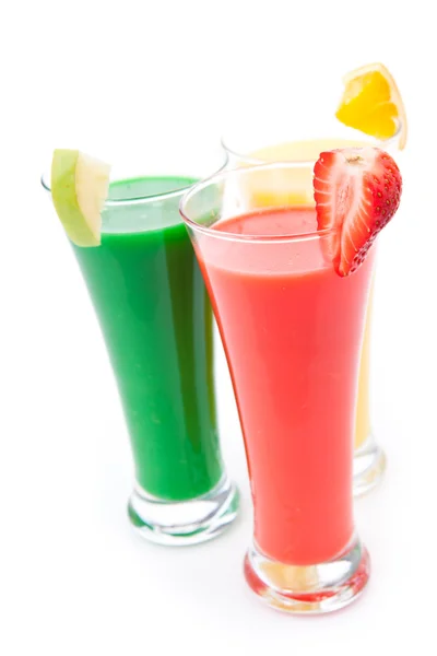 Three full glasses with fruit pieces — Stock Photo, Image