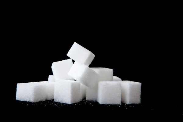 Zuckerklumpen aufgetürmt — Stockfoto