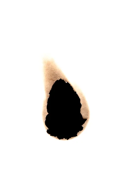 Small burned hole in paper — Stock Photo, Image