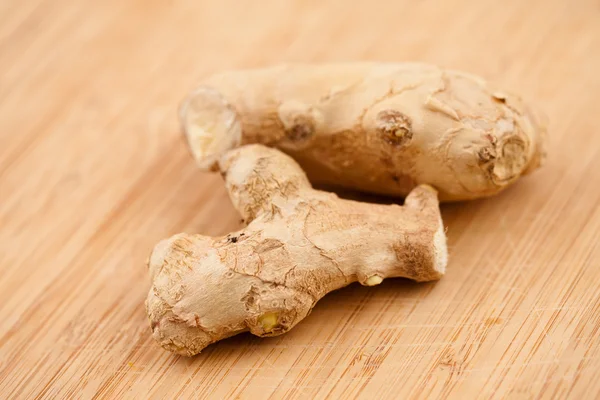 Piece of ginger on a worktop — Stock Photo, Image