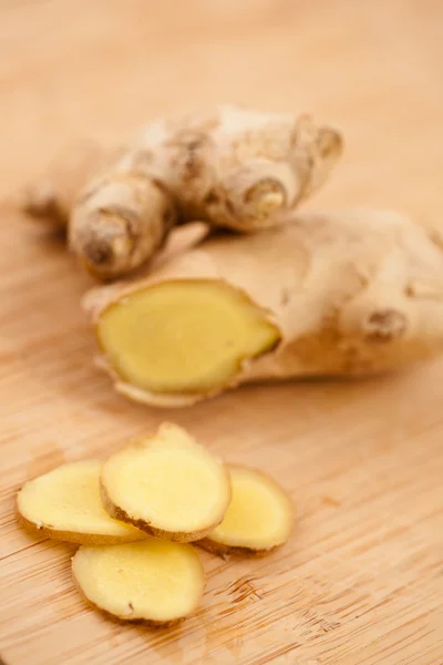 Slice of ginger and blurred piece of ginger — Stock Photo, Image