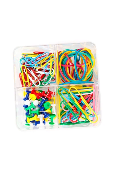 Box of multicolored of pushpins paperclips and elastics — Stock Photo, Image