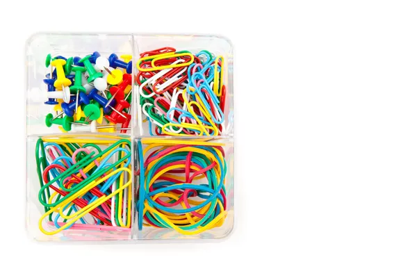 Box with multicolored of pushpins and paperclips — Stock Photo, Image