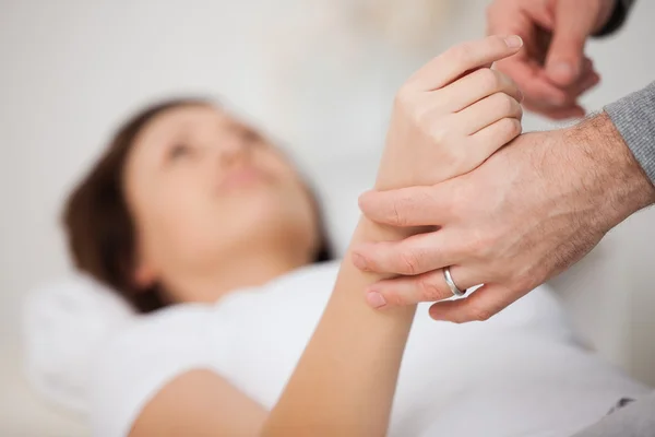 Hand of a woman being manipulated — Stock Photo, Image